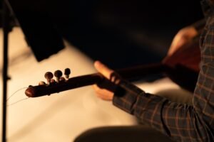 Man playing the traditional saz